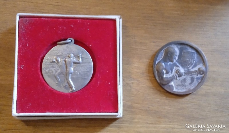 2 wrestling metals one is dated 1931