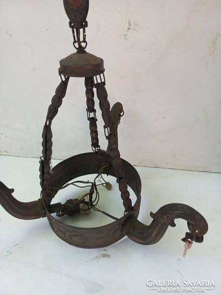 Two chandeliers in antique found condition. Teak and metal