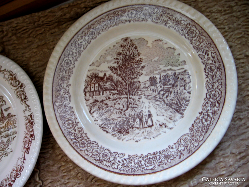 Brown and white scene of English plate in village, chatting couple