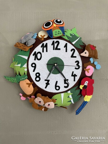 Unique handmade felt clock in a circle with colorful animals