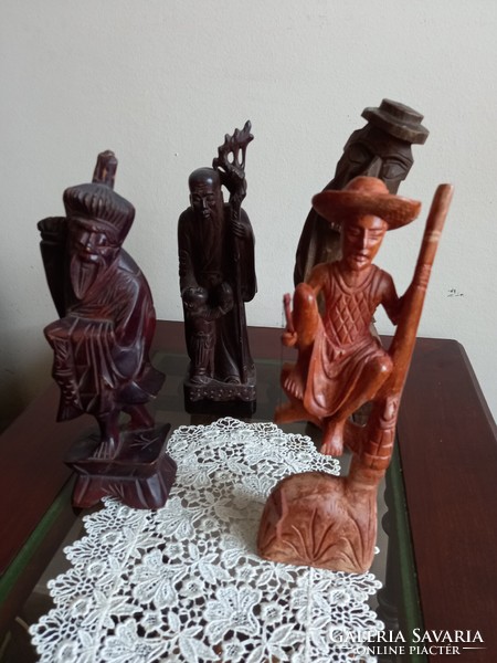 Carved wooden figures in one