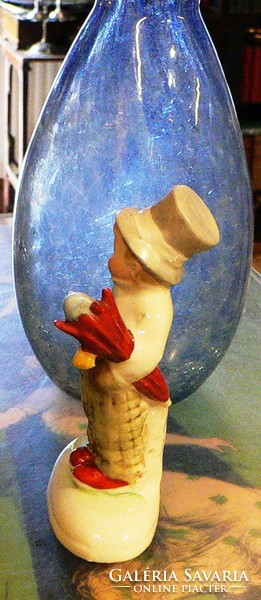 Germany porcelain. Little boy in hat with umbrella