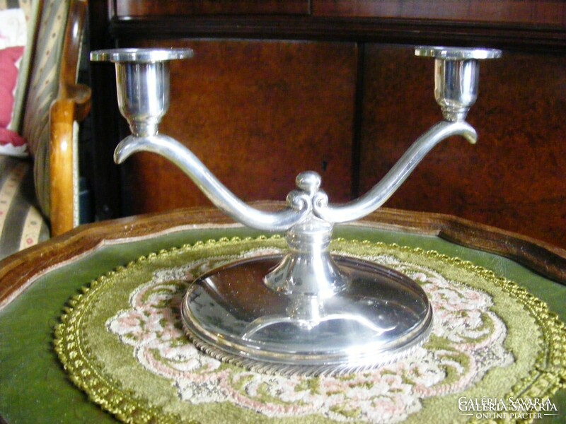 High-gloss, silver-plated medium-sized elegant candle holder to enhance the festive atmosphere