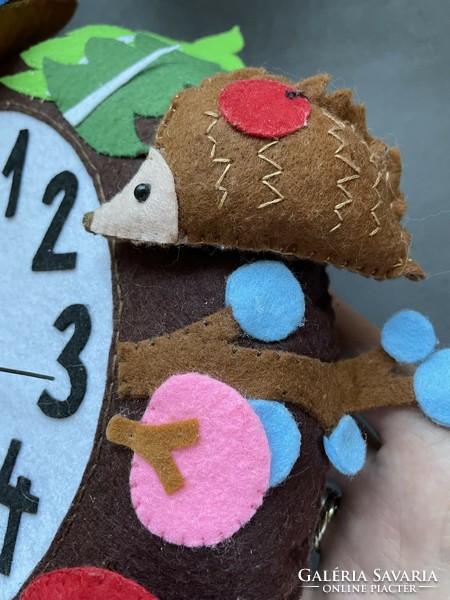 Unique handmade felt clock in a circle with colorful animals