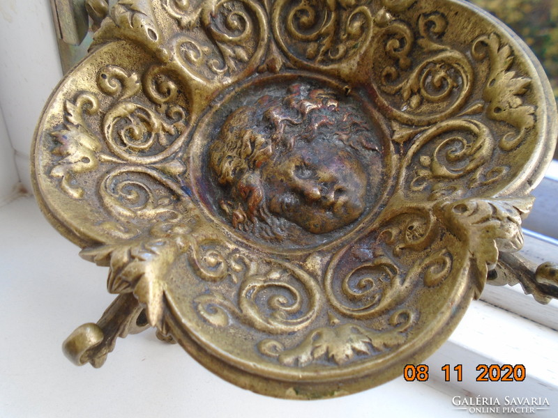 18 S rococo plastic putto with face, fire-gilded bronze bowl, with decorative tongs, on goat legs