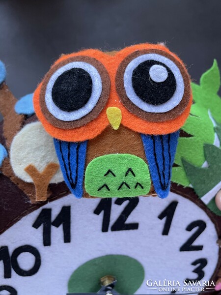 Unique handmade felt clock in a circle with colorful animals