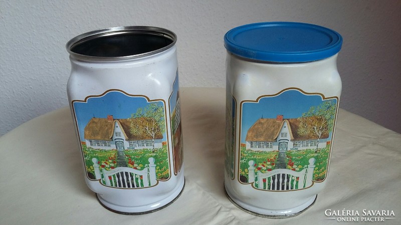 Two old metal / tin boxes with rural buildings on the side (there is only one roof)