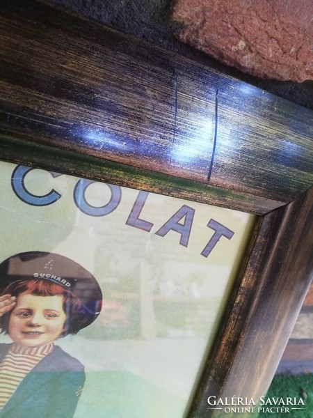 Chocolate advertising in a glazed wooden frame