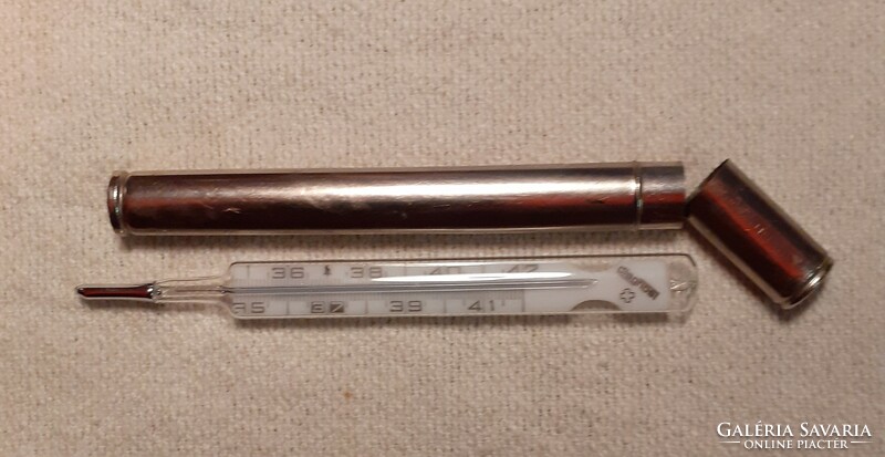 Old thermometer in a metal case with a thermometer