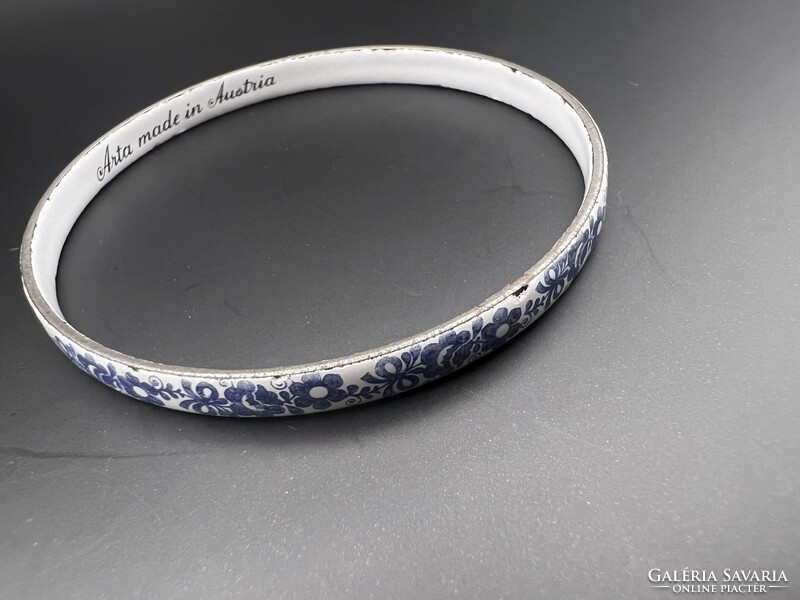 Fire enamel bracelet with a blue flower pattern on a white background