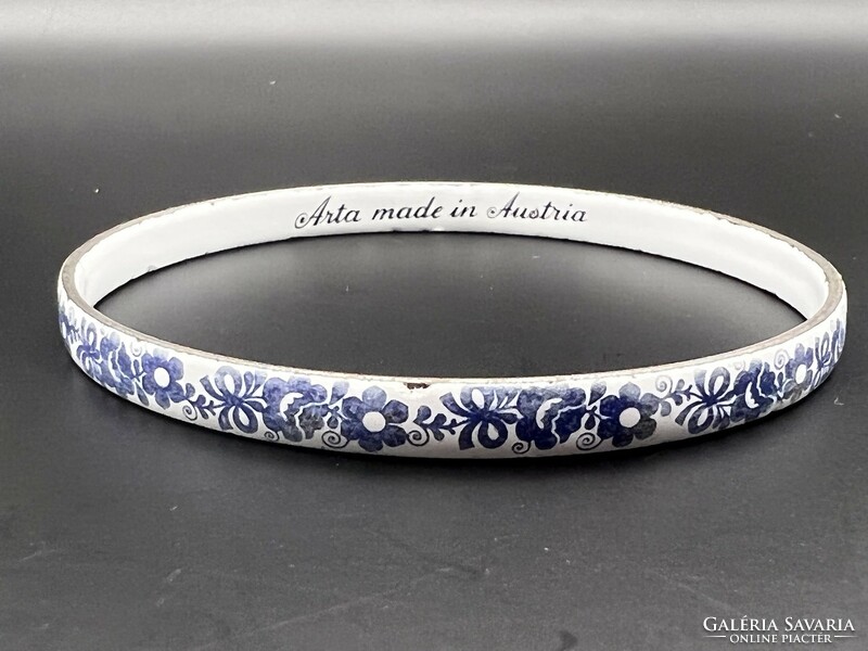 Fire enamel bracelet with a blue flower pattern on a white background