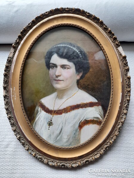 Female portrait painting, in an oval frame