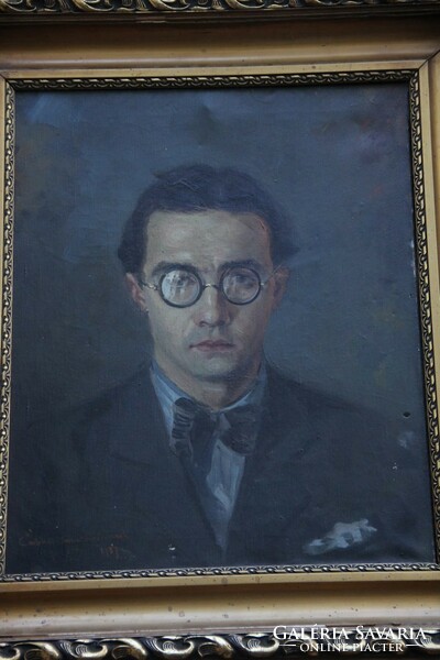 István Nagy with sign - male portrait