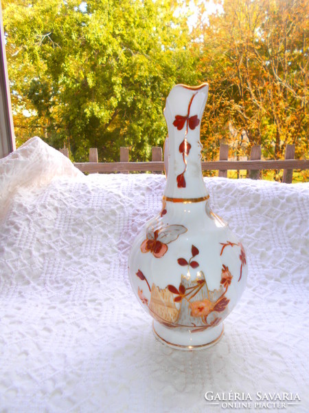 Antique hand-painted porcelain carafe with a traditional oriental pattern