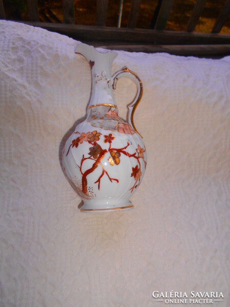 Antique hand-painted porcelain carafe with a traditional oriental pattern