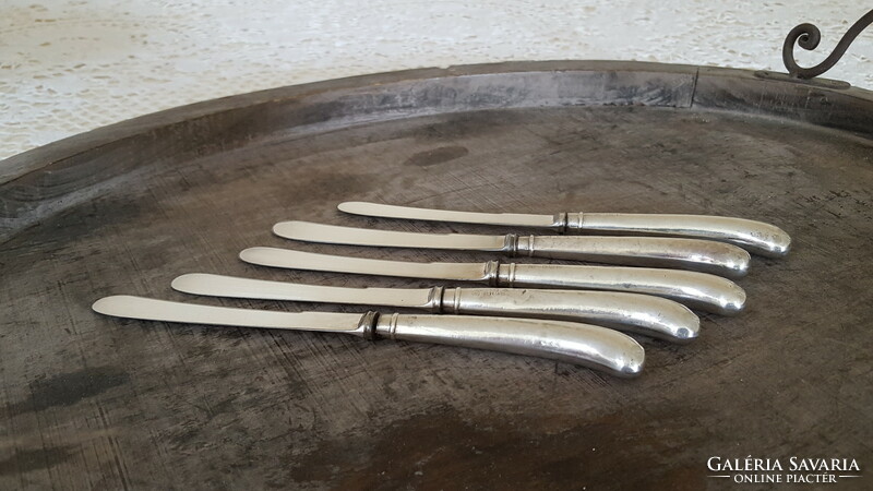 5 silver-handled English dessert or butter knives.