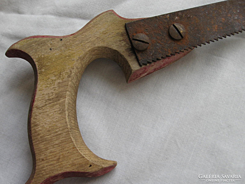 Old, large, marked, beautiful hand saw