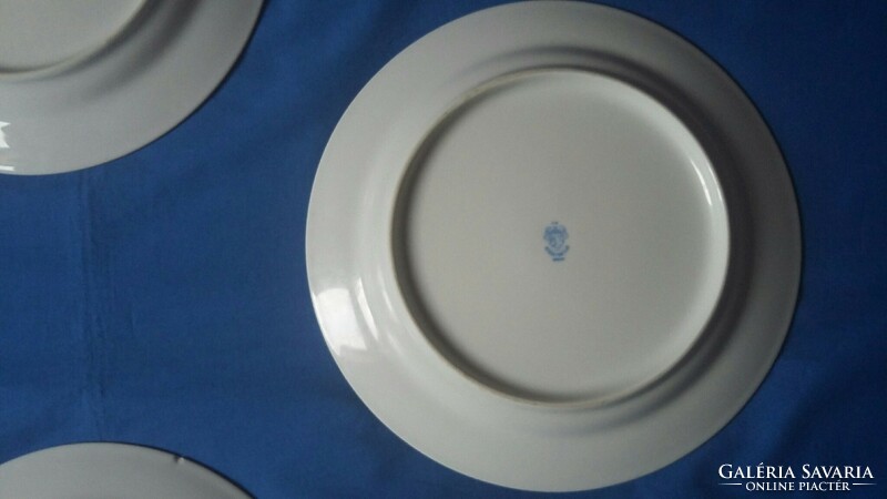 Four old lowland porcelain flat plates with a flower pattern