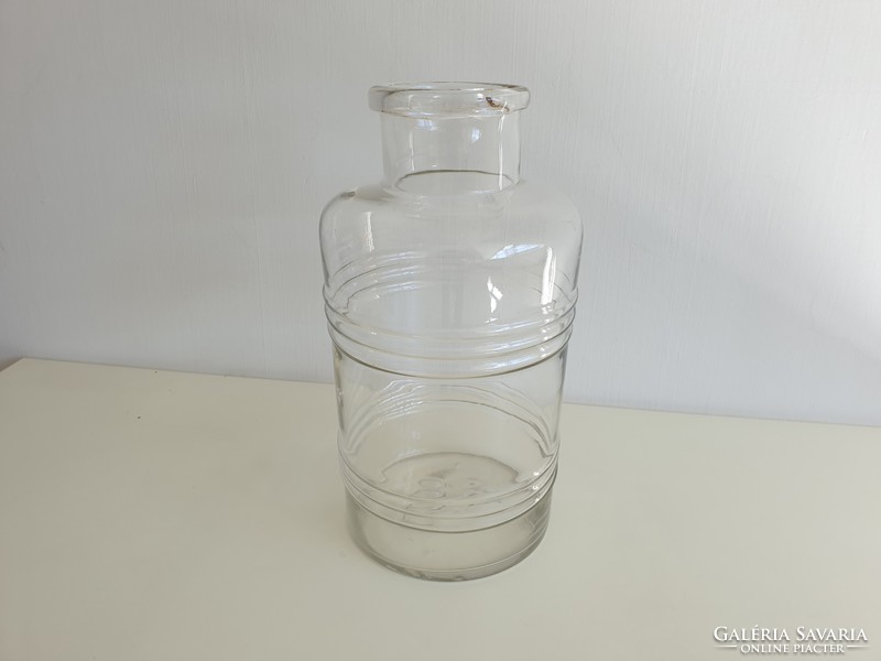 Old vintage mason jar in the shape of a 6 liter striped convex patterned barrel