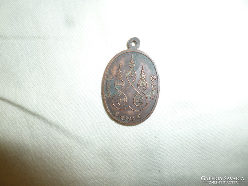 Old small Asian bronze pendant