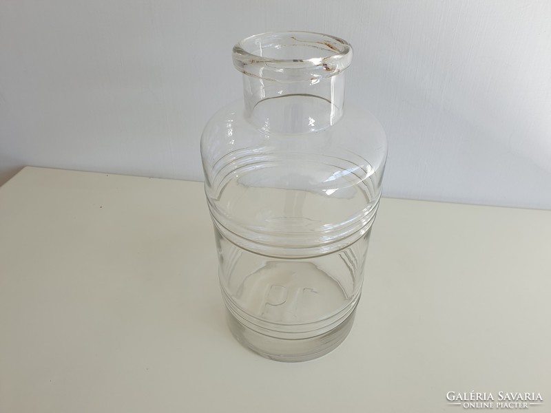 Old vintage mason jar in the shape of a 6 liter striped convex patterned barrel