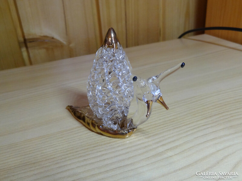 Handmade crystal snail with 24 carat gold hand painted on it.