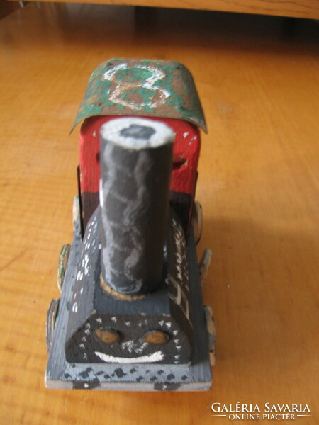 Handmade wooden and iron toy locomotive