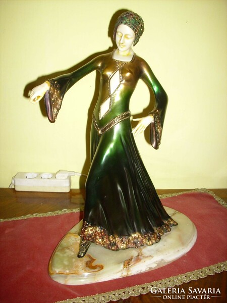 A beautiful art-deco dancing woman on onyx feet