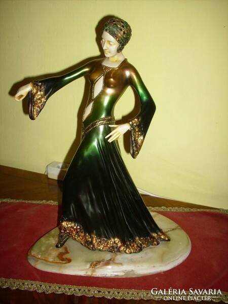 A beautiful art-deco dancing woman on onyx feet