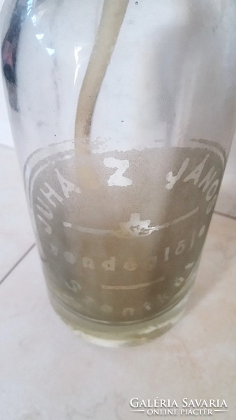 Old soda bottle in the restaurant of John the Shepherd with a soda bottle inscribed with a holy well