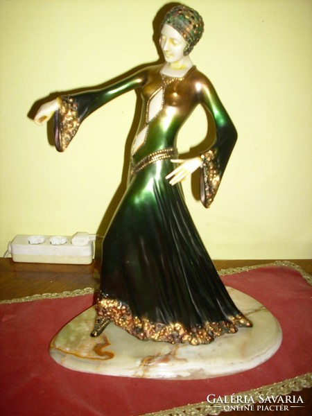 A beautiful art-deco dancing woman on onyx feet