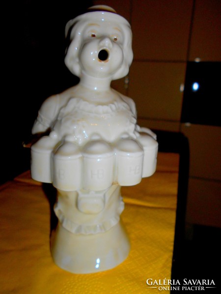 Female figure with small majolica short drink small bottle