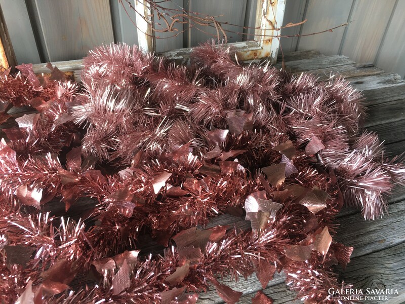 Tired pink tinsel garland with bell decoration