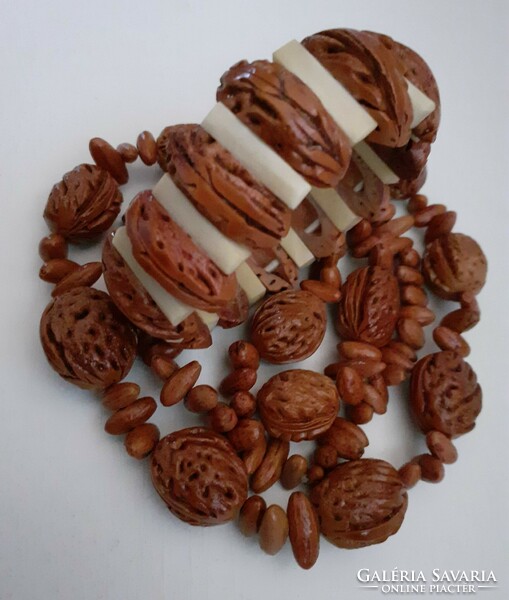Old retro long necklace made of peach kernels in good condition with a matching bracelet