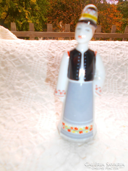 Small hand-painted porcelain boy figurine from Hóllóháza in folk costume