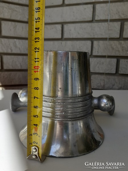 Old aluminum mortar and pestle with confectioner tool