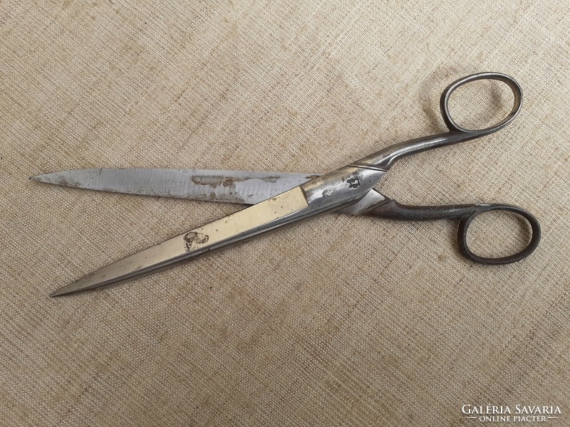 Old long marked tailor's scissors with an excellent edge