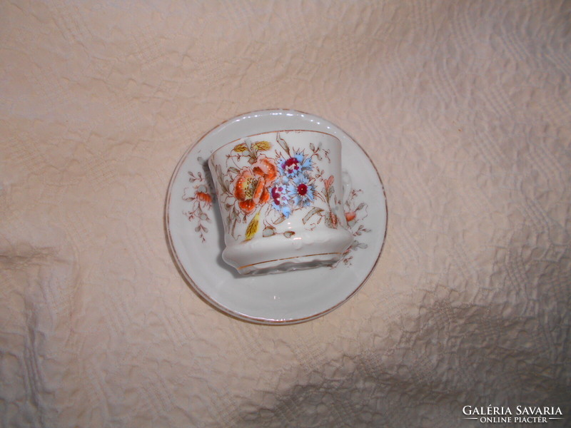 Hand painted porcelain tea cup and saucer