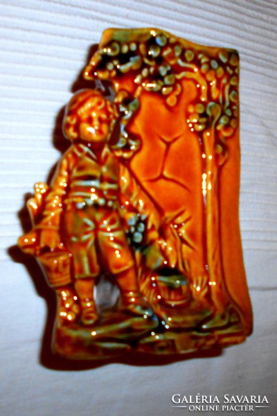 A majolica vase decorated with an antique figure