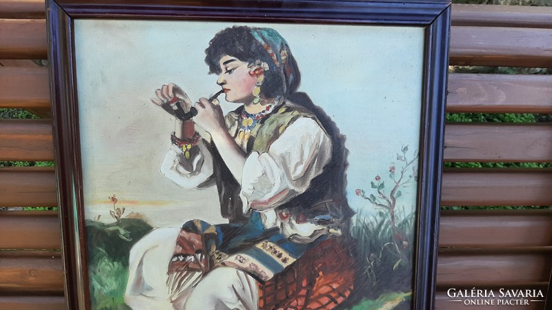 Gypsy girl smoking a pipe