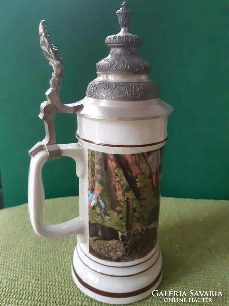 A tin-ceramic jug in very good condition.