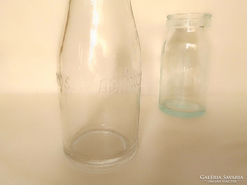 Two small old molded milk bottles, 0.25 and 0.2 l, 'to be returned after washing'