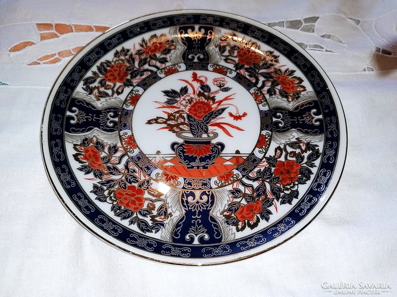 Imari porcelain, Japanese plate, with characteristic red flowers.