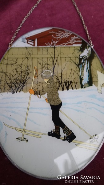 A wall painting painted on a glass depicting a little boy skiing in a beautiful old Art Nouveau winter scene!
