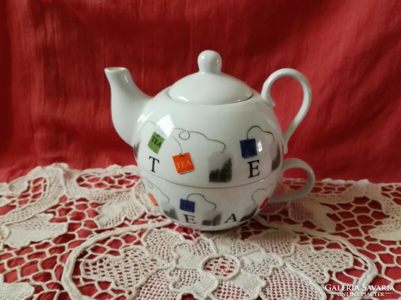 A personal porcelain tea set...Cup and pourer in one.