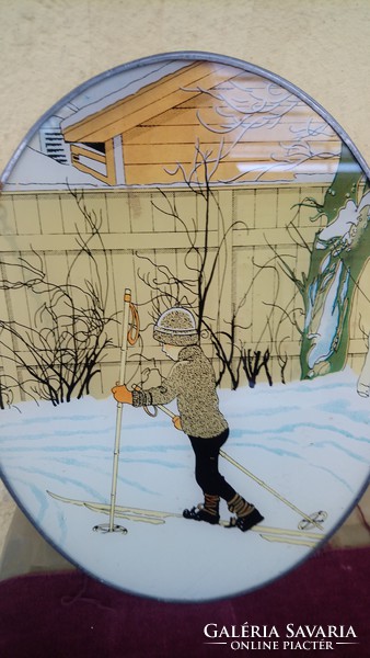 A wall painting painted on a glass depicting a little boy skiing in a beautiful old Art Nouveau winter scene!