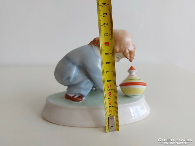 Old Zsolnay porcelain boy with humming snail
