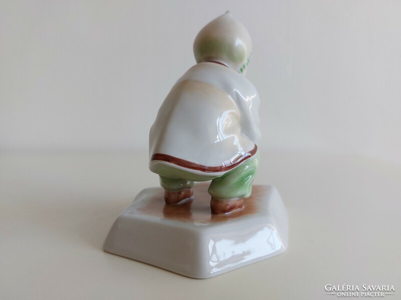 Old Zsolnay porcelain boy with a cap and a ball
