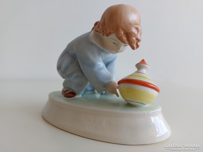 Old Zsolnay porcelain boy with humming snail