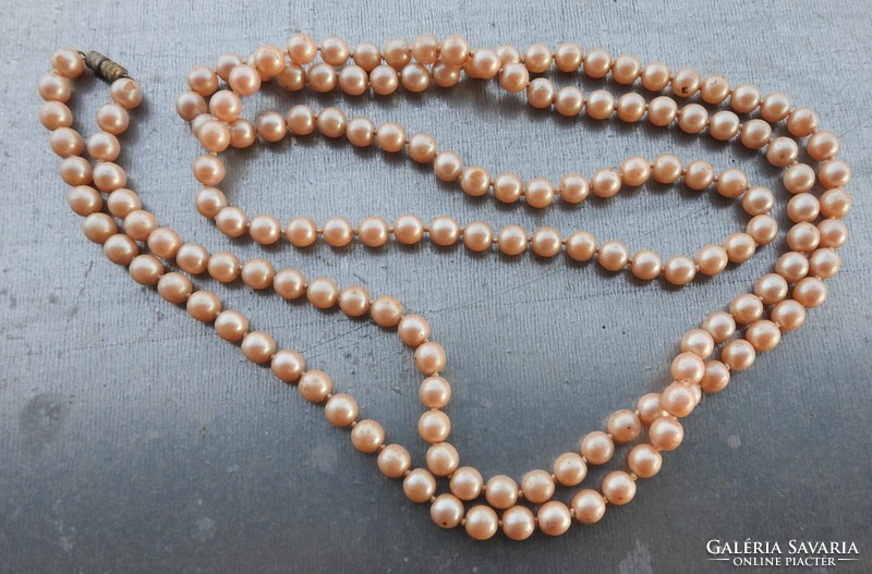 Antique butter colored string of pearls